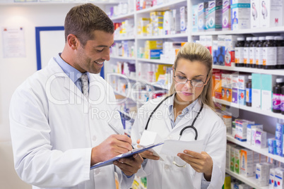 Pharmacist looking a medication for a prescription