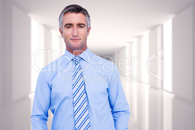 Composite image of smiling businessman in suit with hands in poc