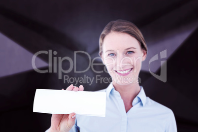 Composite image of businesswoman showing her business card