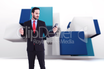 Composite image of handsome businessman texting on phone