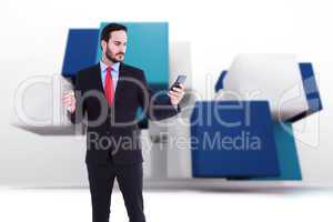 Composite image of handsome businessman texting on phone