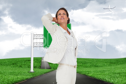 Composite image of thinking businesswoman