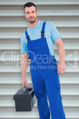 Composite image of repairman with toolbox