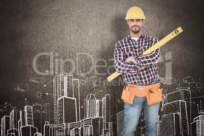 Composite image of smiling handyman holding spirit level