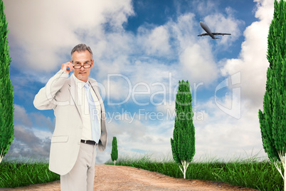 Composite image of thinking businessman