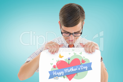 Composite image of geeky hipster smiling and showing card