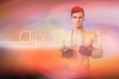 Composite image of portrait of a serious shirtless young muscula