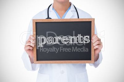 Parents against doctor showing little blackboard