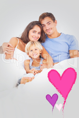 Composite image of lovely family embracing