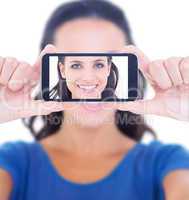 Composite image of pretty brunette smiling at camera