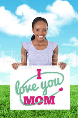 Composite image of woman with placeholder in her hands on white