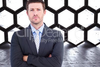 Composite image of businessman looking at the camera Composite image of businessman looking at the camera