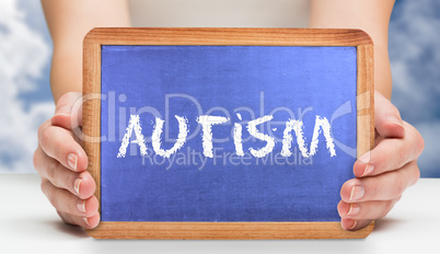 Autism against bright blue sky with clouds