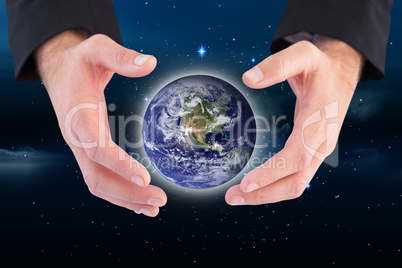 Composite image of businessman holding hand out in presentation