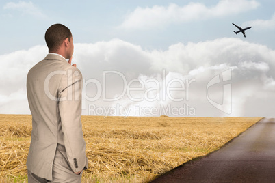 Composite image of thinking businessman