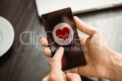 Composite image of hand holding smartphone