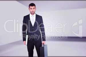 Composite image of businessman standing with his briefcase and d