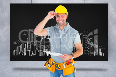 Composite image of portrait of smiling manual worker holding cli