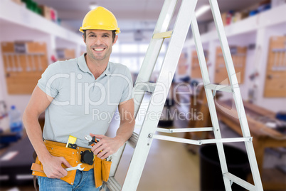 Composite image of worker holding tools while leaning on step la