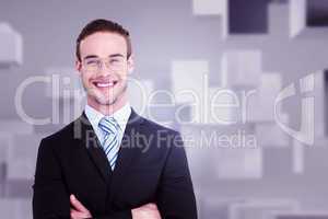 Composite image of smiling businessman in suit with arms crossed