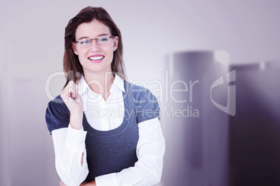 Composite image of smiling woman looking at camera