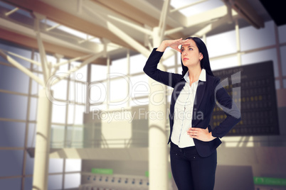 Composite image of pretty businesswoman looking with hand up