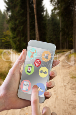 Composite image of hand holding smartphone