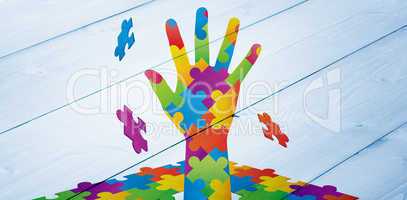 Composite image of autism awareness hand