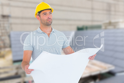 Composite image of thoughtful male architect holding blueprint