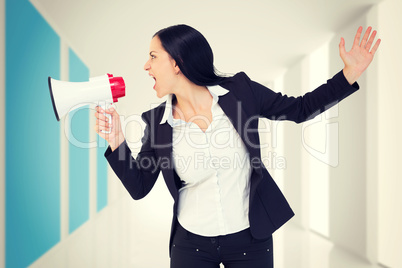 Composite image of pretty businesswoman shouting with megaphone