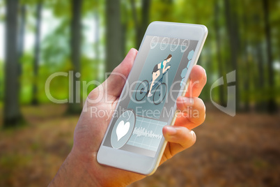 Composite image of hand holding smartphone