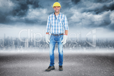 Composite image of full length portrait of confident handyman