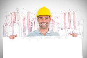 Composite image of happy handyman holding placard on white backg