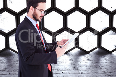 Composite image of businessman scrolling on his digital tablet Composite image of businessman scrolling on his digital tablet