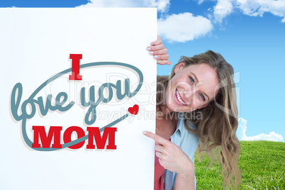 Composite image of woman holding poster