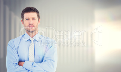 Composite image of businessman looking at the camera