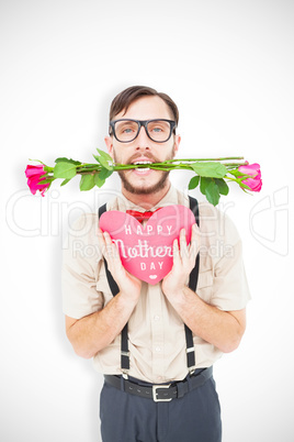 Composite image of geeky hipster offering valentines gifts