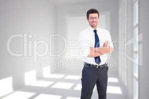 Composite image of handsome businessman smiling at camera