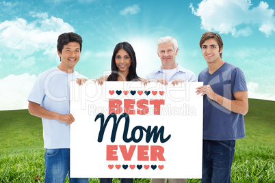 Composite image of people in jeans holding a big sign