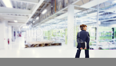 Composite image of businesswoman holding diary