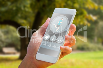 Composite image of hand holding smartphone