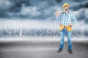 Composite image of thoughtful worker carrying wooden planks