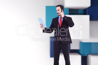 Composite image of businessman talking on phone holding tablet p