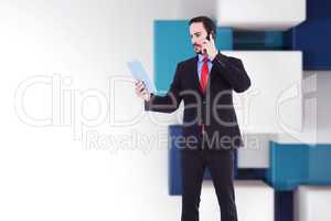 Composite image of businessman talking on phone holding tablet p