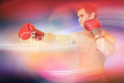 Composite image of muscly man wearing red boxing gloves and punc