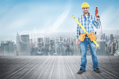 Composite image of portrait of smiling repairman with tools