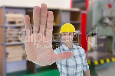 Composite image of carpenter showing palm over white background