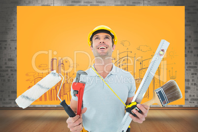 Composite image of worker holding various equipment over white b