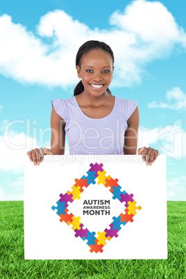 Composite image of woman with placeholder in her hands on white