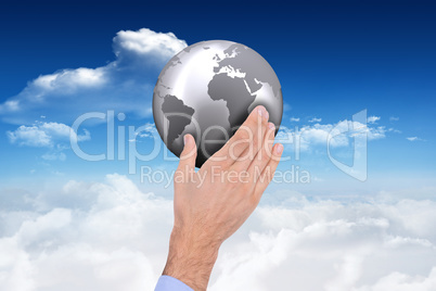 Composite image of businessman holding hand out in presentation